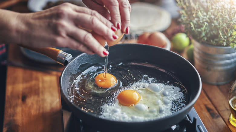 frying eggs in pan