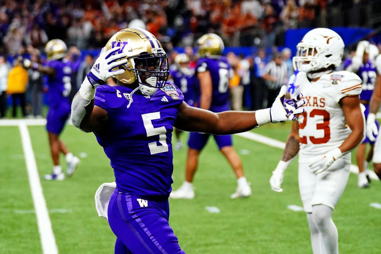 Jan 1, 2024; New Orleans, LA, USA; Washington Huskies linebacker Edefuan Ulofoshio (5) celebrates after the Washington Huskies beat the Texas Longhorns in the 2024 Sugar Bowl college football playoff semifinal game at Caesars Superdome. Mandatory Credit: John David Mercer-USA TODAY Sports