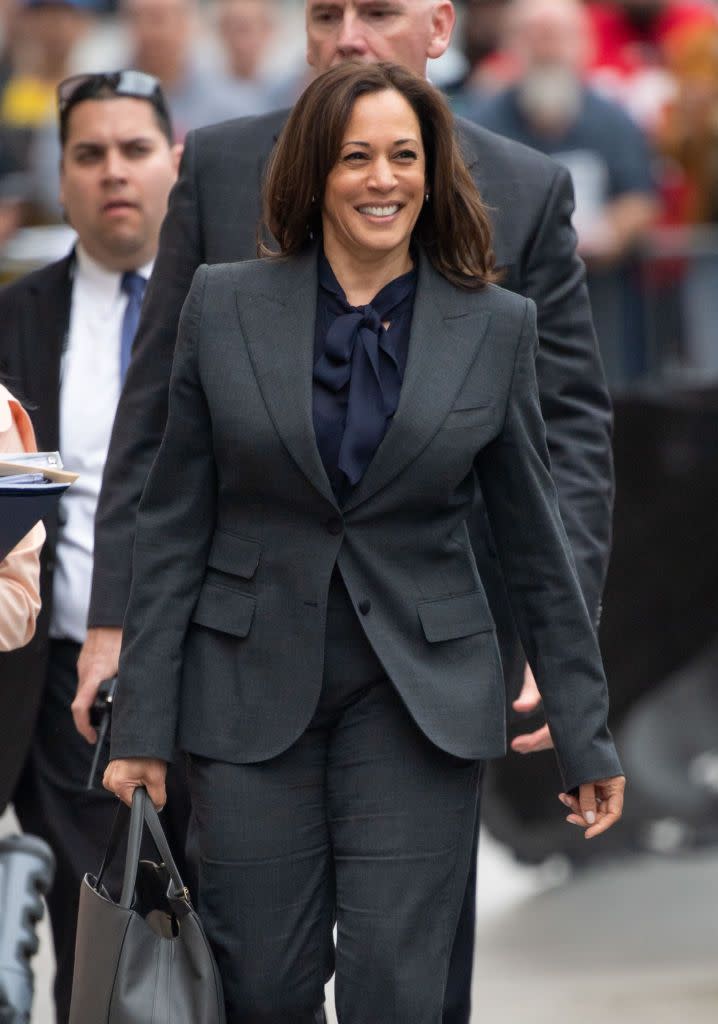 <p>Alongside pearls, and what the Americans call 'pantsuits', Harris is also partial to a pussybow blouse, worn here at Jimmy Kimmel Live during her Presidential bid. </p>