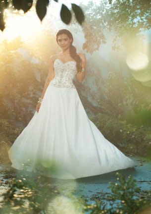 <div class="caption-credit"> Photo by: Alfred Angelo</div><div class="caption-title">Princess Jasmine</div>Jasmine's gown redirects the modern bride into a whole new world of glamour! The fitted bodice is encrusted with crystals and jewels that sparkle like a radiant night sky. <br> <a href="http://www.babble.com/mom/2013-disneys-fairy-tale-weddings-dresses/?cmp=ELP|bbl|lp|YahooShine|Main||030413|||famE|||" rel="nofollow noopener" target="_blank" data-ylk="slk:Get the dress here;elm:context_link;itc:0;sec:content-canvas" class="link "><i>Get the dress here</i></a>