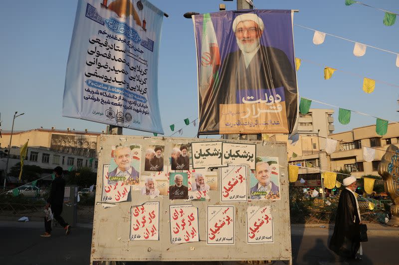 Posters of presidential candidates Masoud Pezeshkian, Saeed Jalili and Mostafa Pourmohammadi are displayed in Tehran