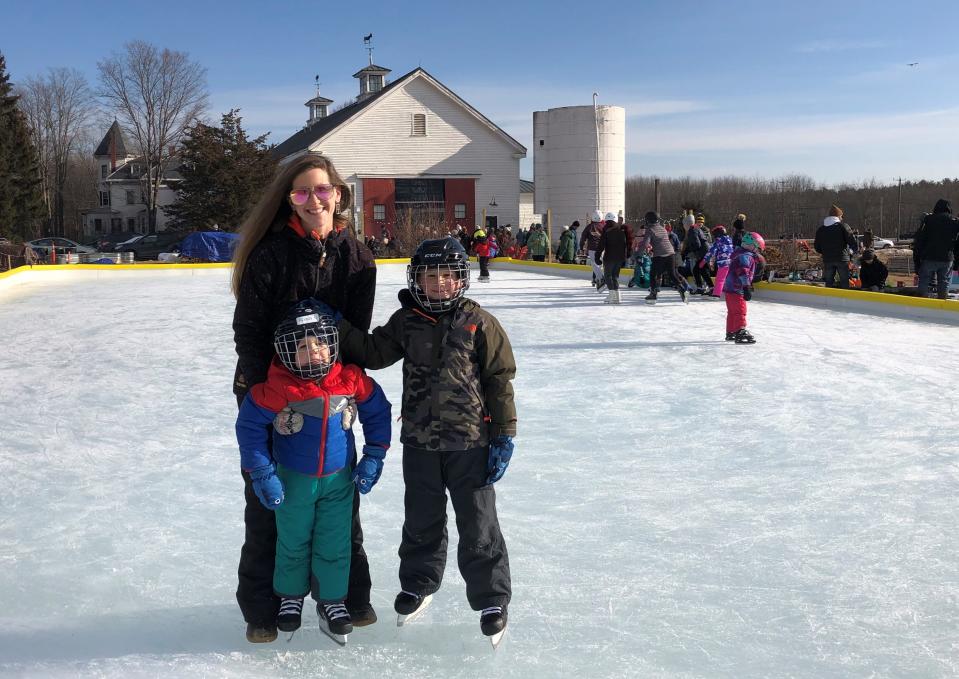 Hampton's Whitney Forbes and her sons Roarke, 3, and Rogan, 8, looked right at home on the ice at the new outdoor rink at Throwback Brewery Sunday.