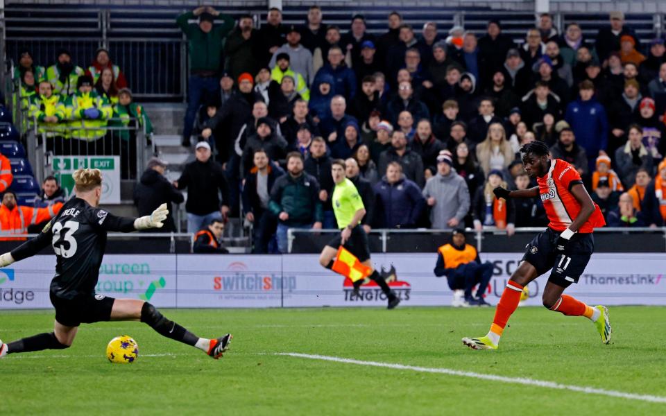 Luton Town's Elijah Adebayo scores their third goal against Brighton