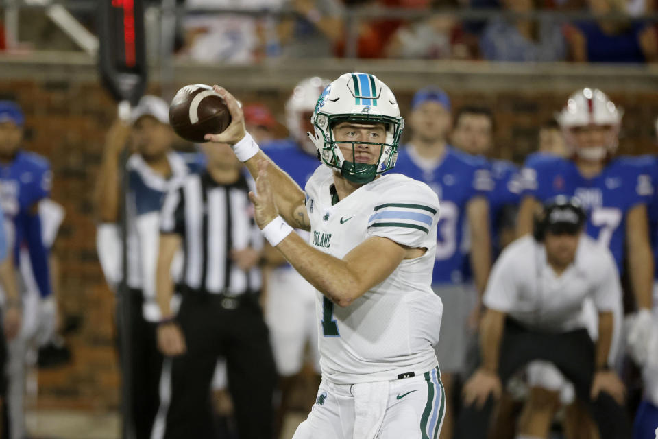 Tulane quarterback Michael Pratt (7) looks for a receiver during the first half of the team's NCAA college football game against SMU in Dallas, Thursday, Oct. 21, 2021. (AP Photo/Michael Ainsworth)