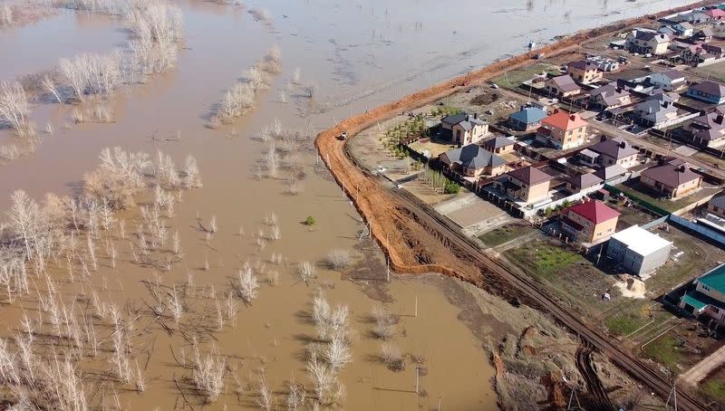 Russian villagers build homemade dam to keep out floods, in Orenburg region