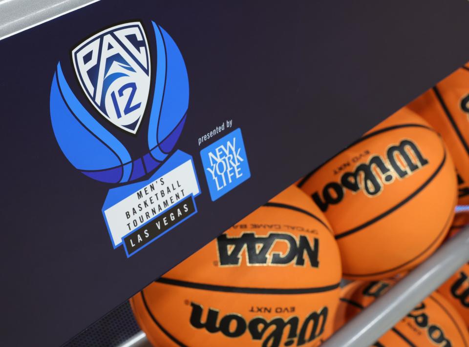 A Pac-12 Conference men's basketball tournament logo is shown on the side of a ball rack before the championship game of the tournament between the Arizona Wildcats and the UCLA Bruins at T-Mobile Arena on March 11, 2023, in Las Vegas, Nevada.