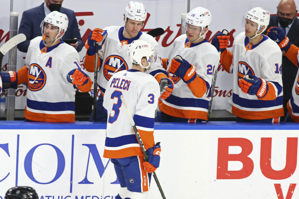 New York Islanders defenseman Adam Pelech (3) celebrates his goal during the first period of an NHL hockey game against the Buffalo Sabres, Monday, May 3, 2021, in Buffalo, N.Y. (AP Photo/Jeffrey T. Barnes)