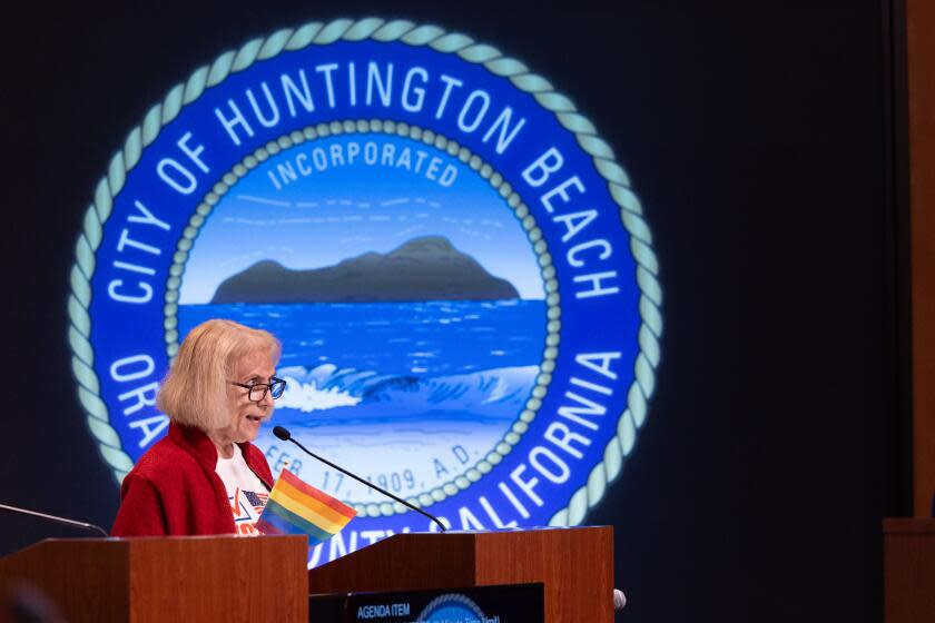 Huntington Beach, CA - January 16: Activist Carol Daus, of Protect Huntington Beach, a group of concerned residents of Huntington Beach who want to increase residents' awareness of proposed charter changes, addresses Huntington Beach city council members during a Huntington Beach City Council meeting in Huntington Beach City Hall Tuesday, Jan. 16, 2024. (Allen J. Schaben / Los Angeles Times)