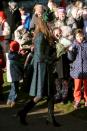 <p>For Christmas Day in Norfolk, Kate donned a tartan coat by Alexander McQueen’s diffusion line, McQ. She also wore a dark green hat by Gina Foster and her trusty knee high Aquatalia boots.</p><p><i>[Photo: PA]</i></p>