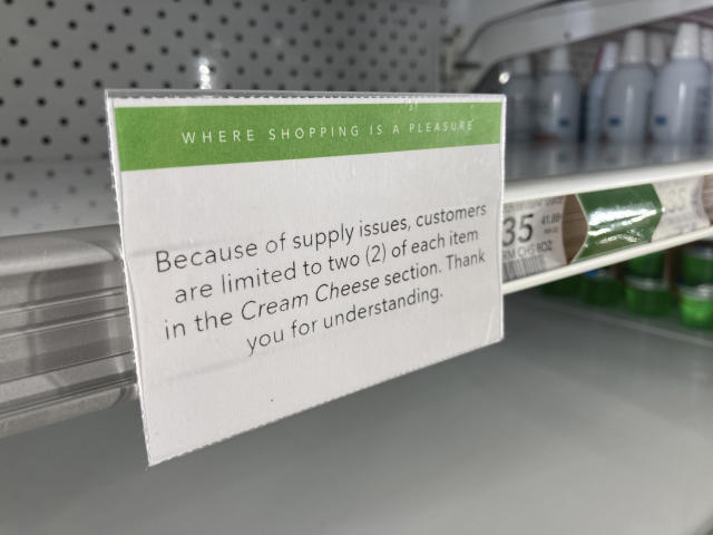 A sign attached to a store shelf alerts shoppers of that an item is in limited supply, Thursday, Jan. 20, 2022, at a grocery store in Surfside, Fla. (AP Photo/Wilfredo Lee)