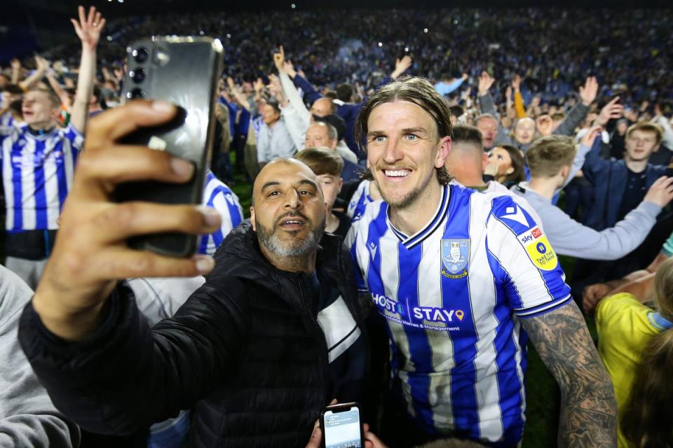 Celebrations: Jubilant Wednesday fans invaded the pitch on an unforgettable night (Getty Images)