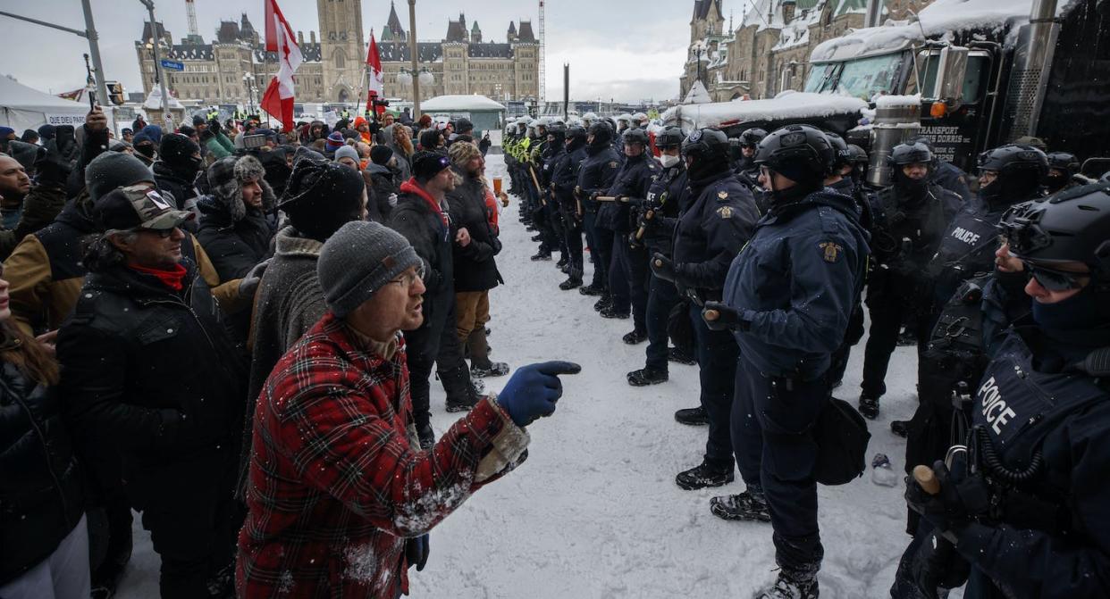 Police move in to clear downtown Ottawa near Parliament Hill of protesters after weeks of demonstrations in February 2022. THE CANADIAN PRESS/Cole Burston