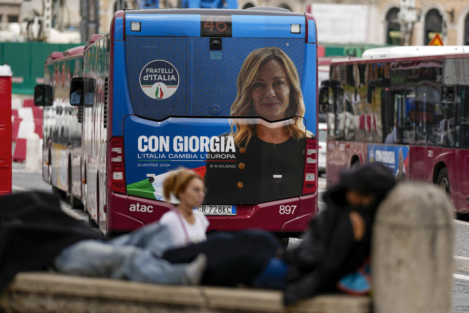 A public transportation bus bears an electoral campaign image for Italian Premier Giorgia Meloni's Brother of Italy party reading in Italian "With Giorgia Italy changes Europe" in Rome, Thursday, May 30, 2024. While Italian Premier Giorgia Meloni adopts a reassuring Western-allied foreign policy, cultural wars at home are preserving her far-right credentials heading into European Parliamentary elections where her neo-fascist-rooted Brothers of Italy party is projected to secure significant gains, and a possible coalition role. (AP Photo/Andrew Medichini)