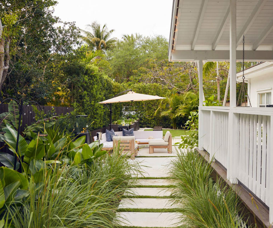 backyard with seating area and parasol