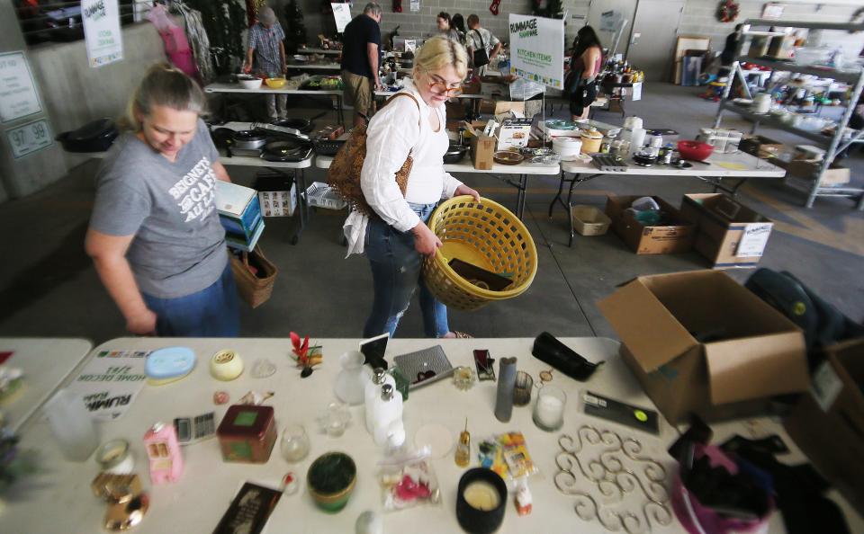 People browse at the Rummage RAMPage, a week-long community garage sale designed to keep reusable items out of the waste stream, at Ames Intermodal Facility in Campustown on Monday, July 31, 2023, in Ames, Iowa.