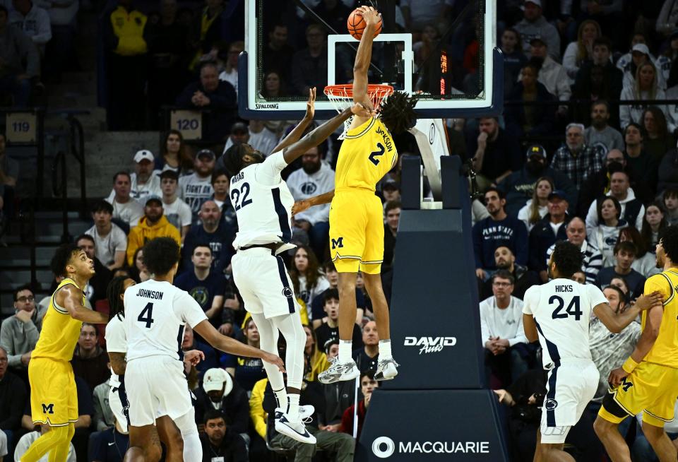 Michigan Wolverines forward Tray Jackson dunks against Penn State Nittany Lions forward Qudus Wahab in the first half at the Palestra on Jan. 7, 2024, in Philadelphia, Pa.
