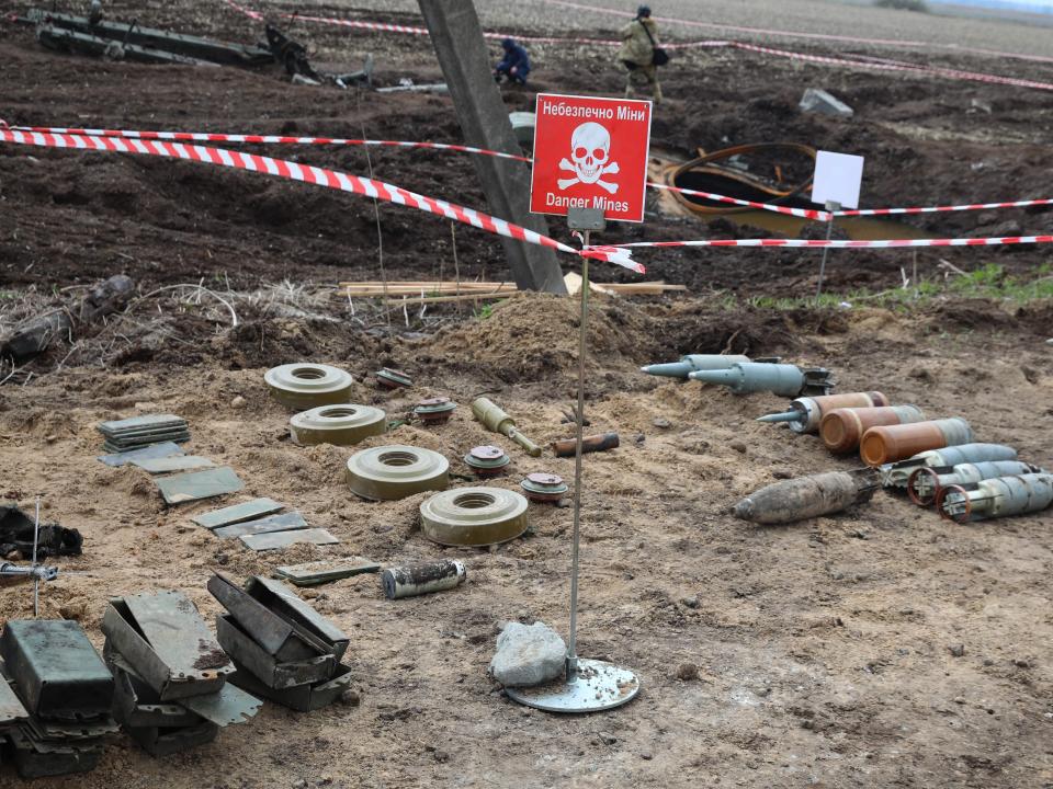 unexploded munitions and other explosive devices as members of a demining team of the State Emergency Service of Ukraine clear mines off a field not far from the town of Brovary, northeast of Kyiv, on April 21, 2022, amid Russian invasion of Ukraine.