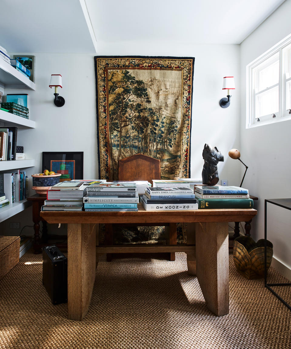 <p> To stop home offices from feeling too perfunctory, injected warmth and personality with a carefully considered choice of antiques, sculpture and art. </p> <p> 'I wanted this room, to feel calm and considered yet restrained and not overly decorated – less is so often more,' says interior designer Tamsin Johnson who designed this room. 'An antique Flemish tapestry forms the backdrop of the scheme. The desk is mid-century and always covered in favourite books; more of them sit on the white-painted floating shelves. This is both a tranquil space and a nice escape.' </p>