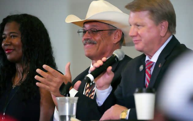 From left, Kristina Karamo, candidate for Michigan secretary of state, Mark Finchem, candidate for Arizona secretary of state, and Jim Marchant, candidate for Nevada secretary of state, attend a conference on conspiracy theories about voting machines and discredited claims about the 2020 presidential election at a hotel in West Palm Beach, Florida, Sept. 10, 2022. (Photo: Jim Rassol via Associated Press)