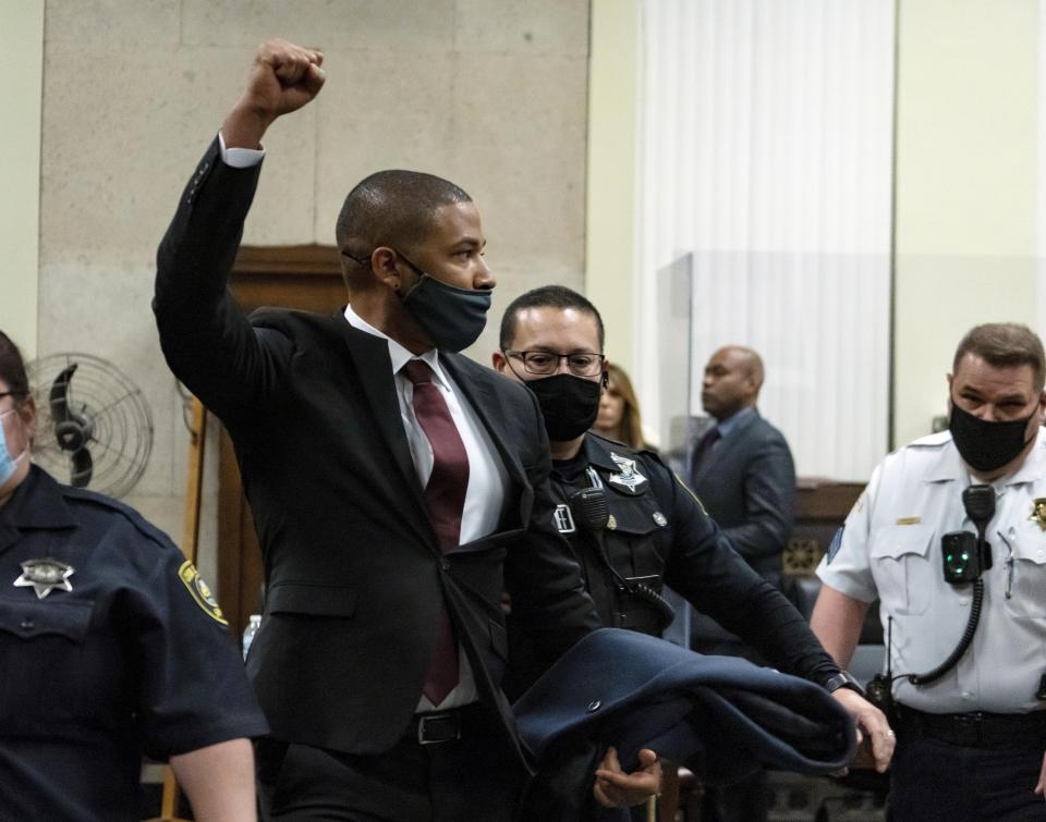 Actor Jussie Smollett is led out of the courtroom after being sentenced at the Leighton Criminal Court Building, Thursday, March 10, 2022, in Chicago. Jussie Smollett maintained his innocence during his sentencing hearing Thursday after a judge sentenced the former “Empire” actor to 150 days in jail for lying to police about a racist and homophobic attack that he orchestrated himself.(Brian Cassella/Chicago Tribune via AP, Pool)