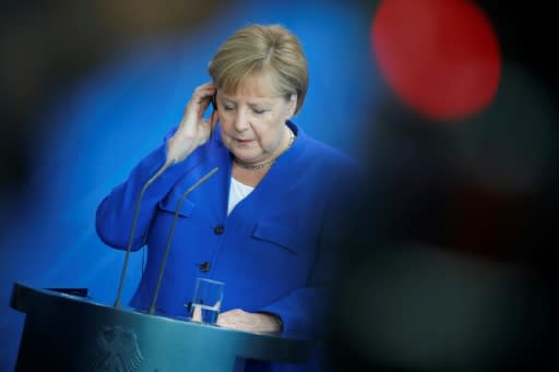 German Chancellor Angela Merkel announced her plan after marathon talks with other political leaders -- but green groups say the measures do not go far enough