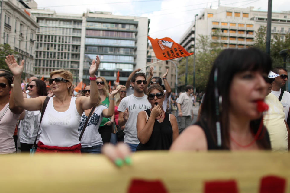 Greek municipal workers protest against the new austerity measures in central Athens, on Wednesday, Sept. 12, 2012. A fresh wave of anti-austerity strikes hit Greece Wednesday as the leaders of the governing coalition struggled to finalize further spending cuts for the coming two years — without which the country will lose its vital rescue loans.(AP Photo/Petros Giannakouris)