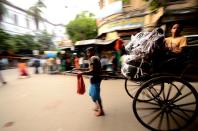 Hand-pulled rickshaws, a throwback to the past, are still common in Kolkata.