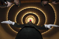 A Chinese military band conductor rehearses before the opening session of the annual National People's Congress in Beijing's Great Hall of the People, Tuesday, March 5, 2019. (AP Photo/Ng Han Guan)