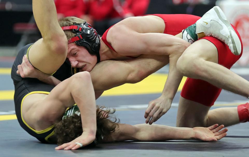 Jaxon Joy of Wadsworth, top, gets on top of Kade Brown of St. Edward during their 132-pound Division I championship match in the OHSAA State Wrestling Tournament at the Jerome Schottenstein Center, Sunday, March 12, 2023, in Columbus, Ohio.