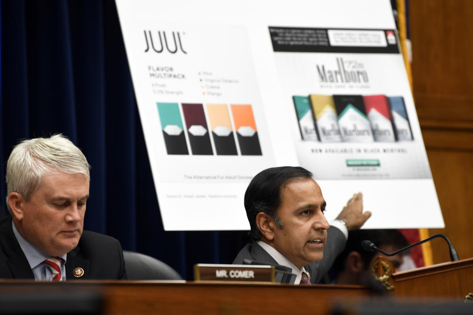 House Oversight and Government Reform subcommittee chair Rep. Raja Krishnamoorthi, D-Ill., right, speaks as he questions JUUL Labs co-founder and Chief Product Officer James Monsees during a subcommittee hearing on Capitol Hill in Washington, Thursday, July 25, 2019, on the youth nicotine epidemic. Subcommittee ranking member Rep. James Comer, R-Ky., is at left. (AP Photo/Susan Walsh)