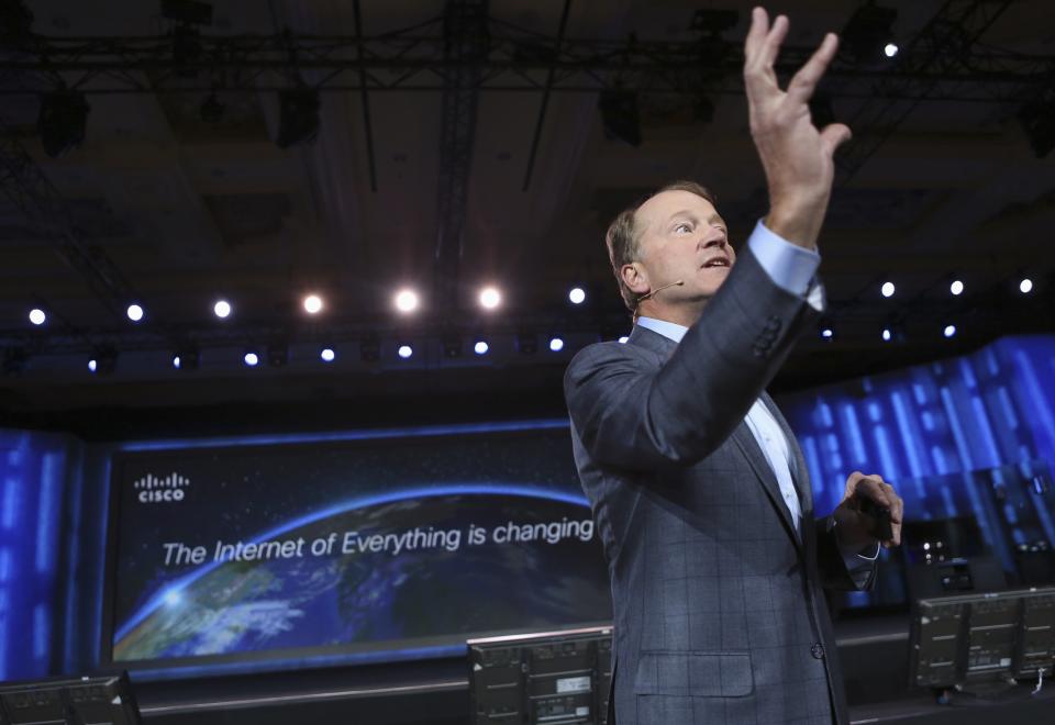 Cisco CEO John Chambers gestures while delivering his keynote speech at the annual Consumer Electronics Show (CES) in Las Vegas, Nevada January 7, 2014. REUTERS/Robert Galbraith (UNITED STATES - Tags: BUSINESS SCIENCE TECHNOLOGY)