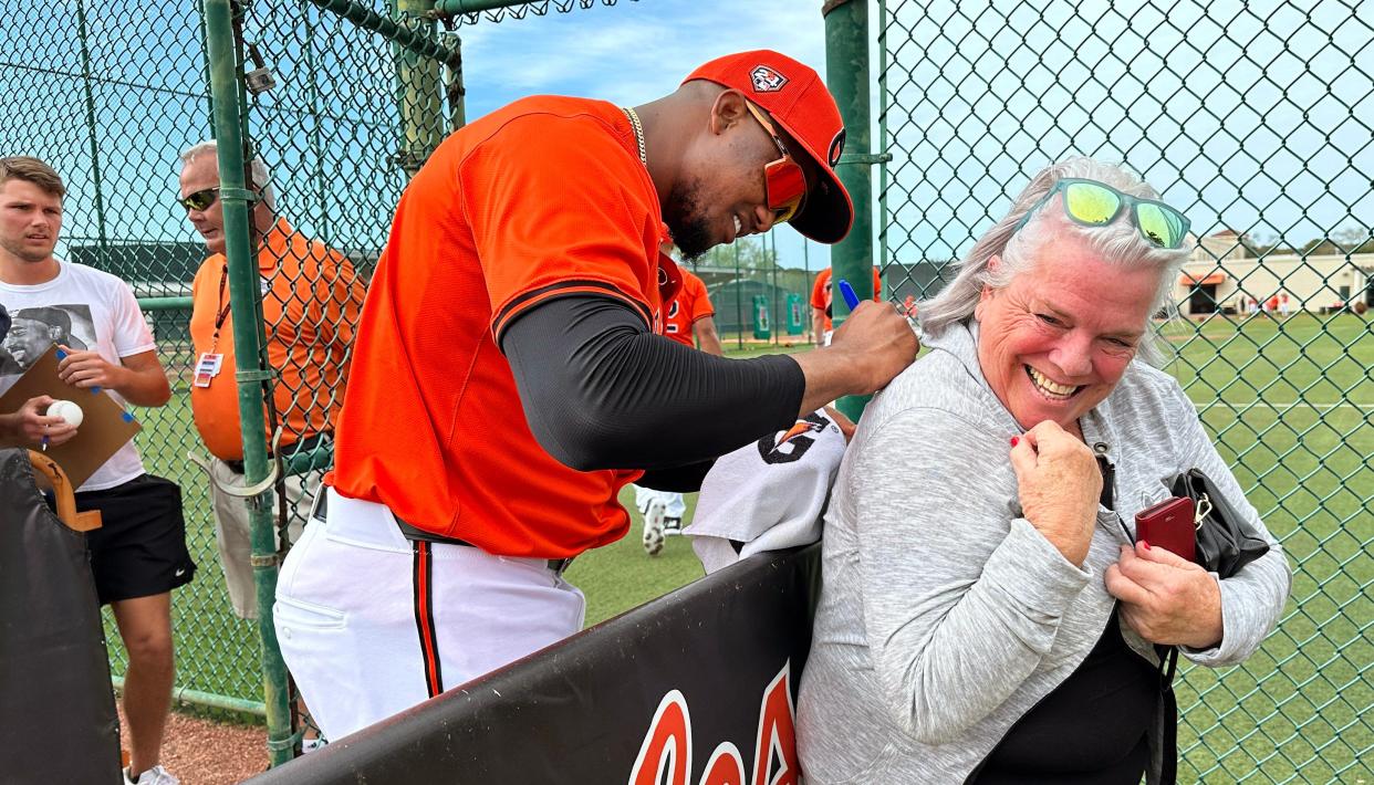 Pat Morin of Venice, gets her shirt signed by her favorite player, Baltimore Orioles pitcher Yennier Cano. Morin, originally from Baltimore, has lived in Venice for nine years and is still a big Orioles fan. The Orioles have been going through their annual spring training workouts at Ed Smith Stadium in Sarasota.