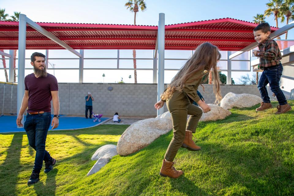 Hector De La Torre, left, watches two of his kids, Kaely, 5, and Ulises, 2, play at the College of the Desert’s new Child Development Center in Indio, Calif., on Tuesday, January 23, 2024. De La Torre’s spouse is a full time student at College of the Desert.