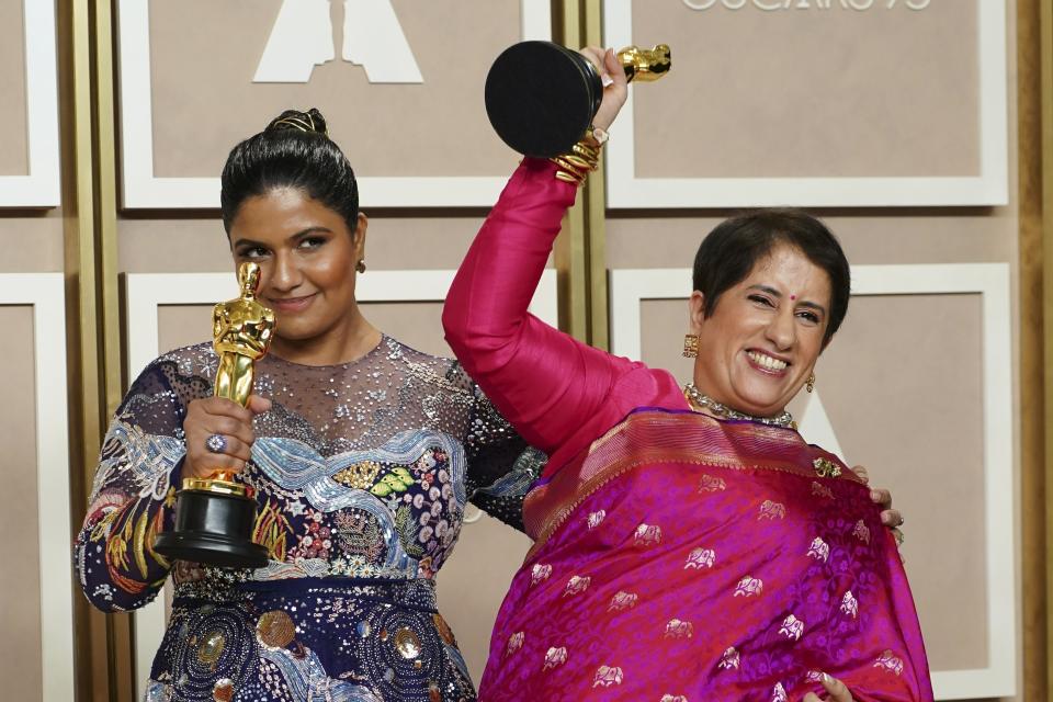 Kartiki Gonsalves, left, and Guneet Monga pose with the award for best documentary short film for "The Elephant Whisperer" in the press room at the Oscars on Sunday, March 12, 2023, at the Dolby Theatre in Los Angeles. (Photo by Jordan Strauss/Invision/AP)