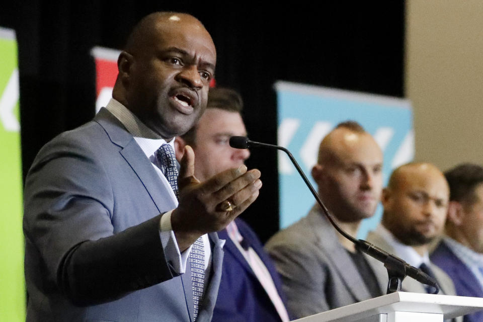 DeMaurice Smith speaks at the podium during the annual state of the union news conference.