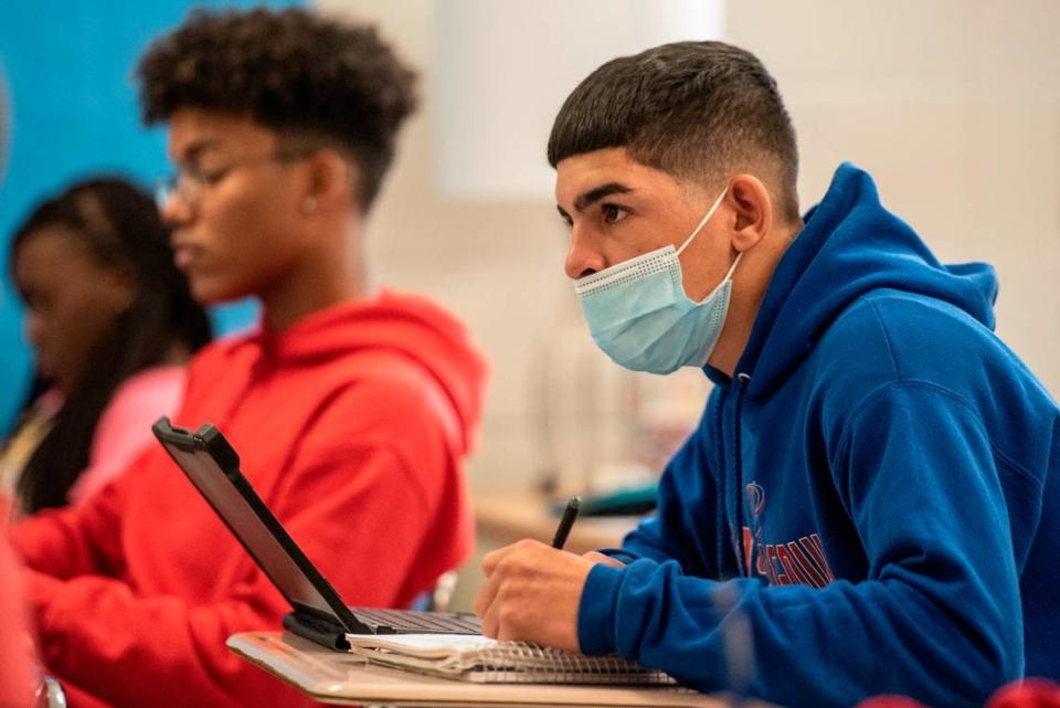 Angel Solivan listens as he works on his classwork during Hayden Roberts’ history class at Pascagoula High School on Monday, Oct. 25, 2021. Solivan is one of many students in the class whose first language is not English.