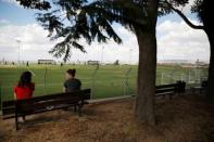 Women watch players from Ariel Municipal Soccer Club, who are affiliated with the Israel Football Association, train ahead of their match against Maccabi HaSharon Netanya at Ariel Municipal Soccer Club's training grounds in the West Bank Jewish settlement of Ariel September 23, 2016. Picture taken September 23, 2016. REUTERS/Amir Cohen