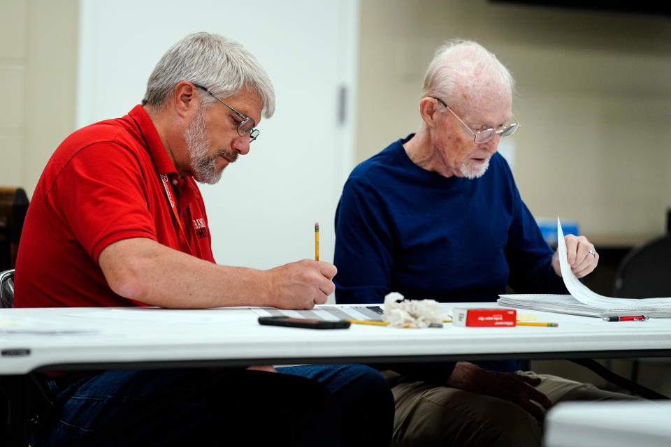 Election workers perform a recount of ballots from the recent primary election at the Montour County administration center in Danville, Pa., Friday, May 27, 2022. (AP Photo/Matt Rourke)