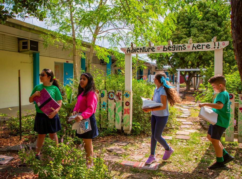 Students walk the garden writing down what they see in the Food Forest at Royal Palm Elementary School on April 22, 2024. Royal Palm Elementary is one of 30 public elementary schools in Miami-Dade Schools with a food forest maintained by the Education Fund.