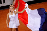 Tennis - Fed Cup - World Group Semi-Final - France v Romania - Kindarena, Rouen, France - April 21, 2019 France's Kristina Mladenovic and Caroline Garcia celebrate victory in the semi-final REUTERS/Charles Platiau