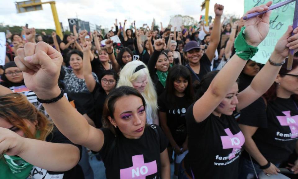 Thousands of women march against gender-based violence in Cancun, Mexico Sunday.