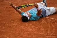 Breakthrough: Italy's Marco Cecchinato celebrates after victory against David Goffin in the fourth round