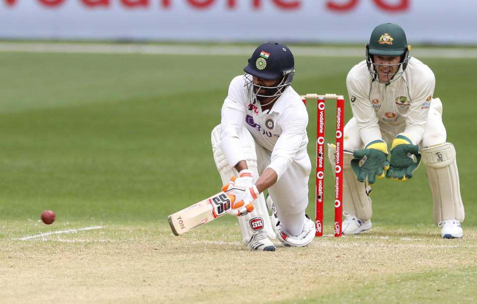 India's Ravindra Jadeja plays a sweep shot during play on day two of the second cricket test between India and Australia at the Melbourne Cricket Ground, Melbourne, Australia, Sunday, Dec. 27, 2020. (AP Photo/Asanka Brendon Ratnayake)
