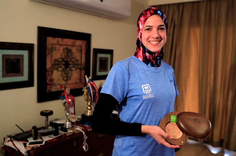 Egyptian Taekwondo practitioner and 2016 Rio Olympics bronze medallist Wahba holds her medal in Cairo