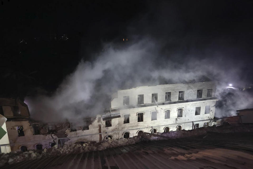 In this photo provided by the Kharkiv Regional Administration, an apartment building damaged in a Russian rocket attack is seen in Kharkiv, Ukraine, in the early hours of Wednesday, Jan. 17, 2024. (Kharkiv Regional Administration via AP)