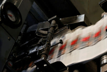 The daily newspaper Delmagyarorszag runs through the press at publishing house Lapcom's press room in Szeged, Hungary, November 9, 2016. REUTERS/Laszlo Balogh