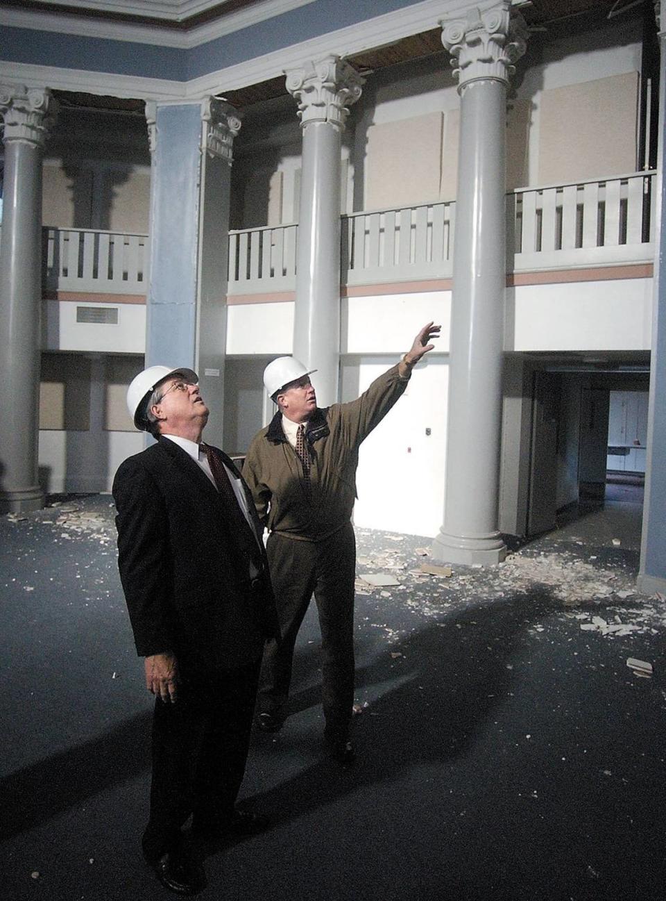 Rep. Bill Thomas, R-Bakersfield, left is given a tour of the damaged city hall by Atascadero City Manager Wade McKinney. This is the rotunda where the city council meets.The city manager was on the fourth floor with department heads when the San Simeon Earthquake occurred.