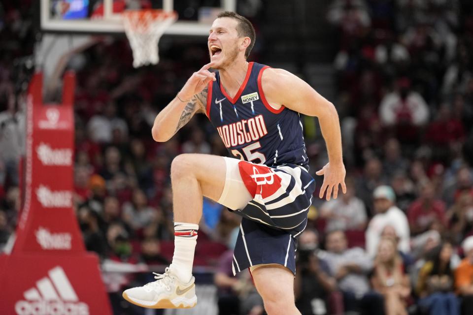 Houston Rockets guard Garrison Mathews reacts after making a three-point basket during the first half of an NBA basketball game against the Milwaukee Bucks, Friday, Dec. 10, 2021, in Houston. (AP Photo/Eric Christian Smith)