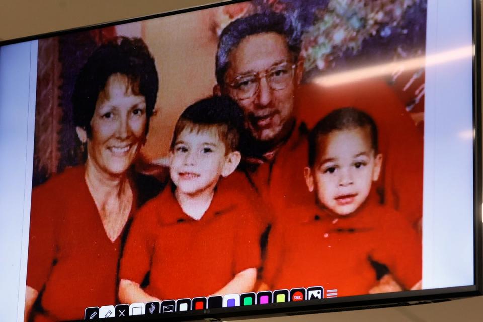 An undated photograph of the Cruz family – Lynda, Nikolas, Roger and Zachary – is shown in the courtroom (AP)