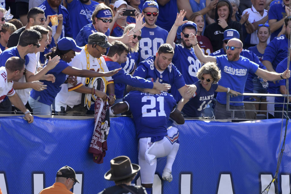 New York Giants free safety Jabrill Peppers celebrates his touchdown with Giants fans during the second half of an NFL football game against the Washington Redskins, Sunday, Sept. 29, 2019, in East Rutherford, N.J. (AP Photo/Bill Kostroun)